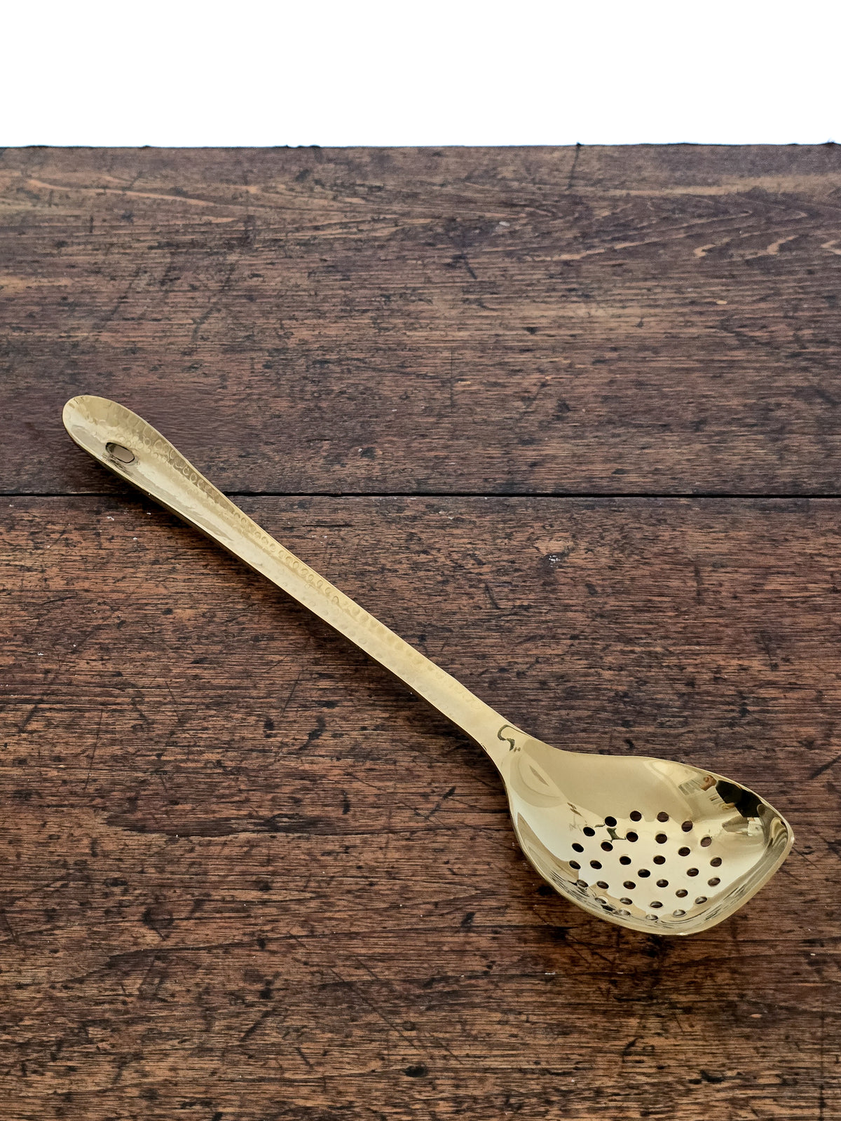Vaisselle _ Ustensiles _ Grande cuillère dorée à trous
